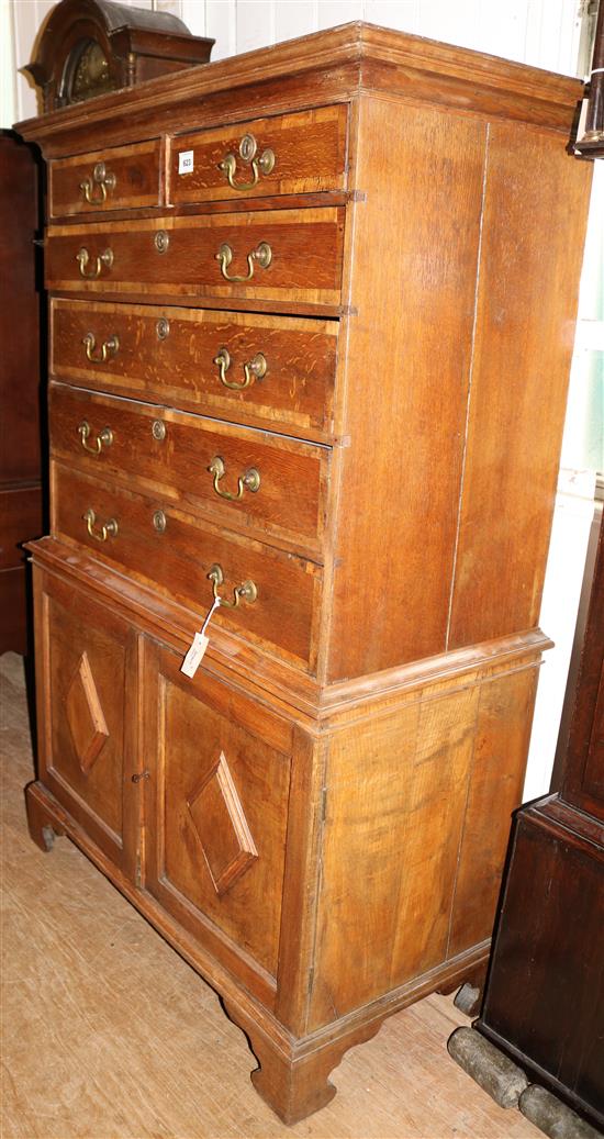 George III mahogany chest on later cupboard base, W.3ft 5in. D.1ft 10in. H.5ft 5in.(-)